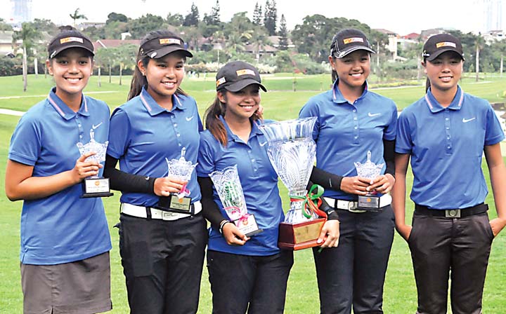 Princess Superal (center) holds her huge trophy and another plum from the team championship as she poses with ICTSI teammates (from left) Sam Martirez, Sofia Chabon, Abegail Arevalo and Yuka Saso after winning the Pondok Indah junior golf crown.